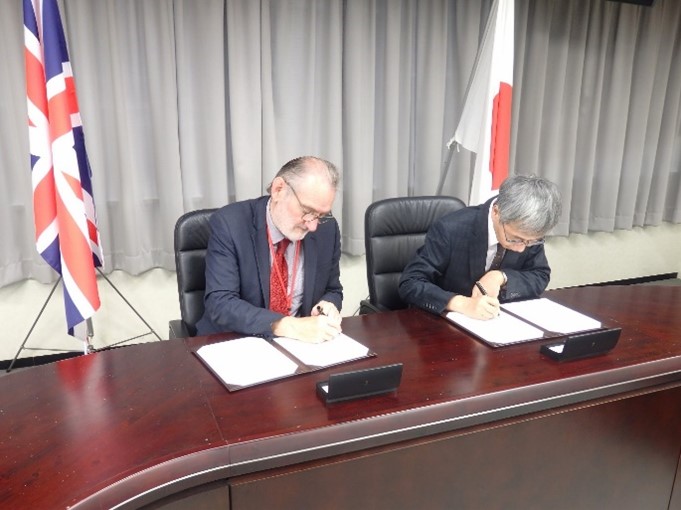 The National Statistician signing a Memorandum of Cooperation in Japan.