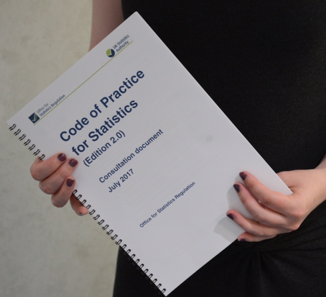 Draft Code of Practice held with two hands