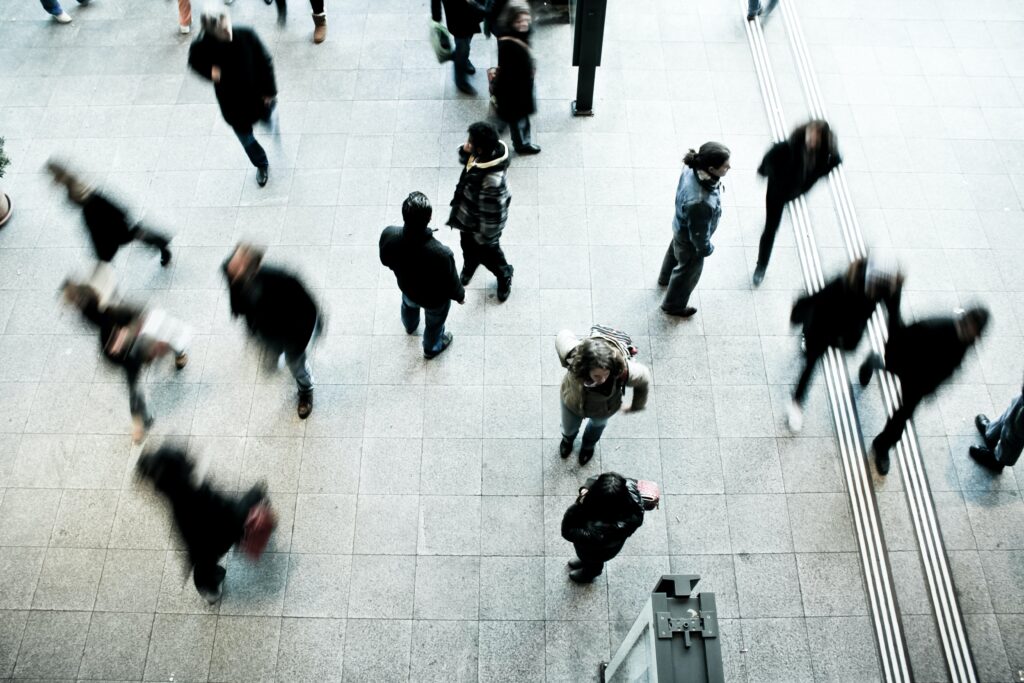 Birds eye view of people walking. Photo by Timon Studler on Unsplash.