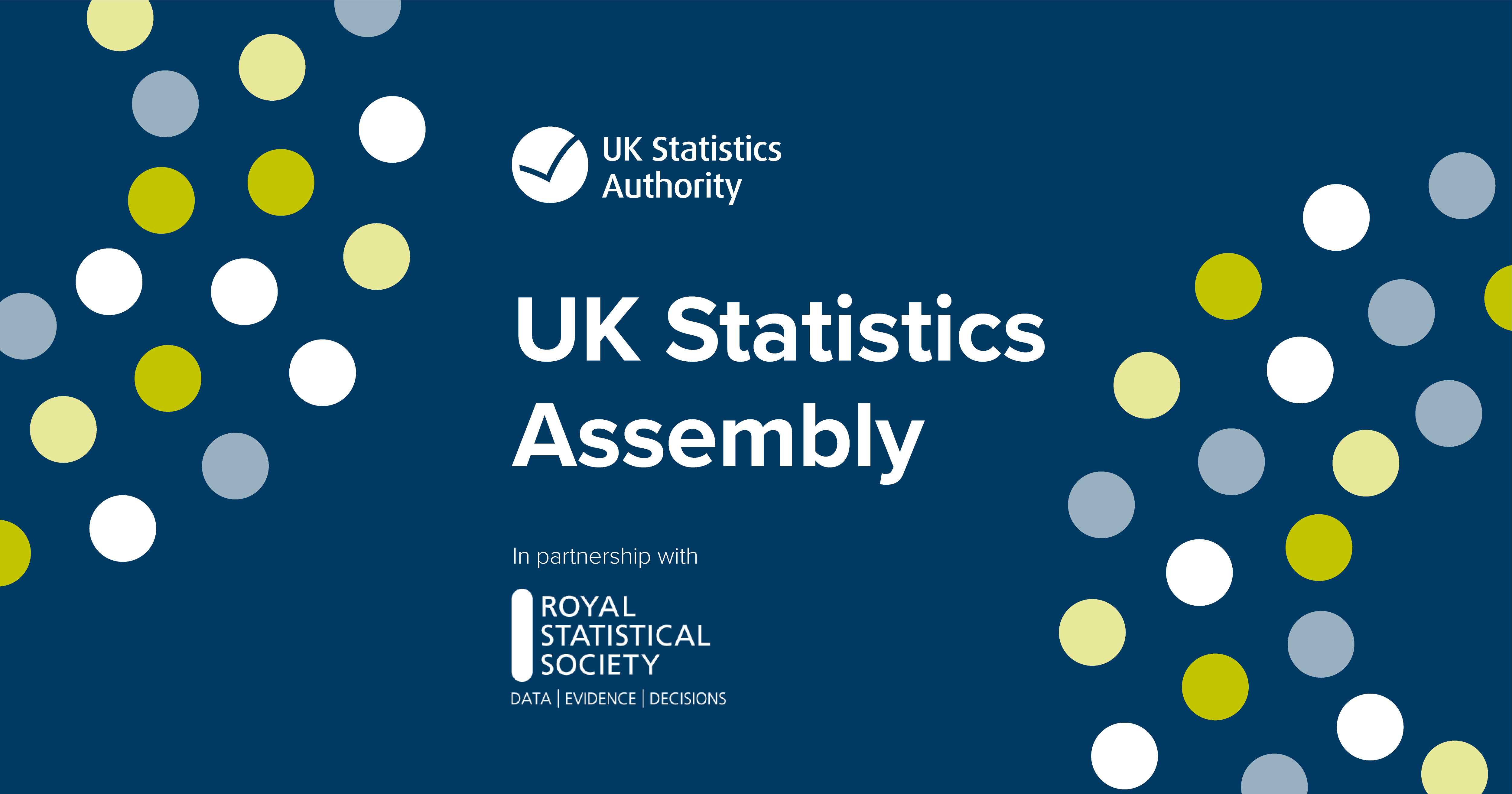 Graphic with blue background and circles dotted around in green and white with white text that read Statistical Assembly with the UK Statistics Authority logo above it and the Royal Statistical Society logo under it.